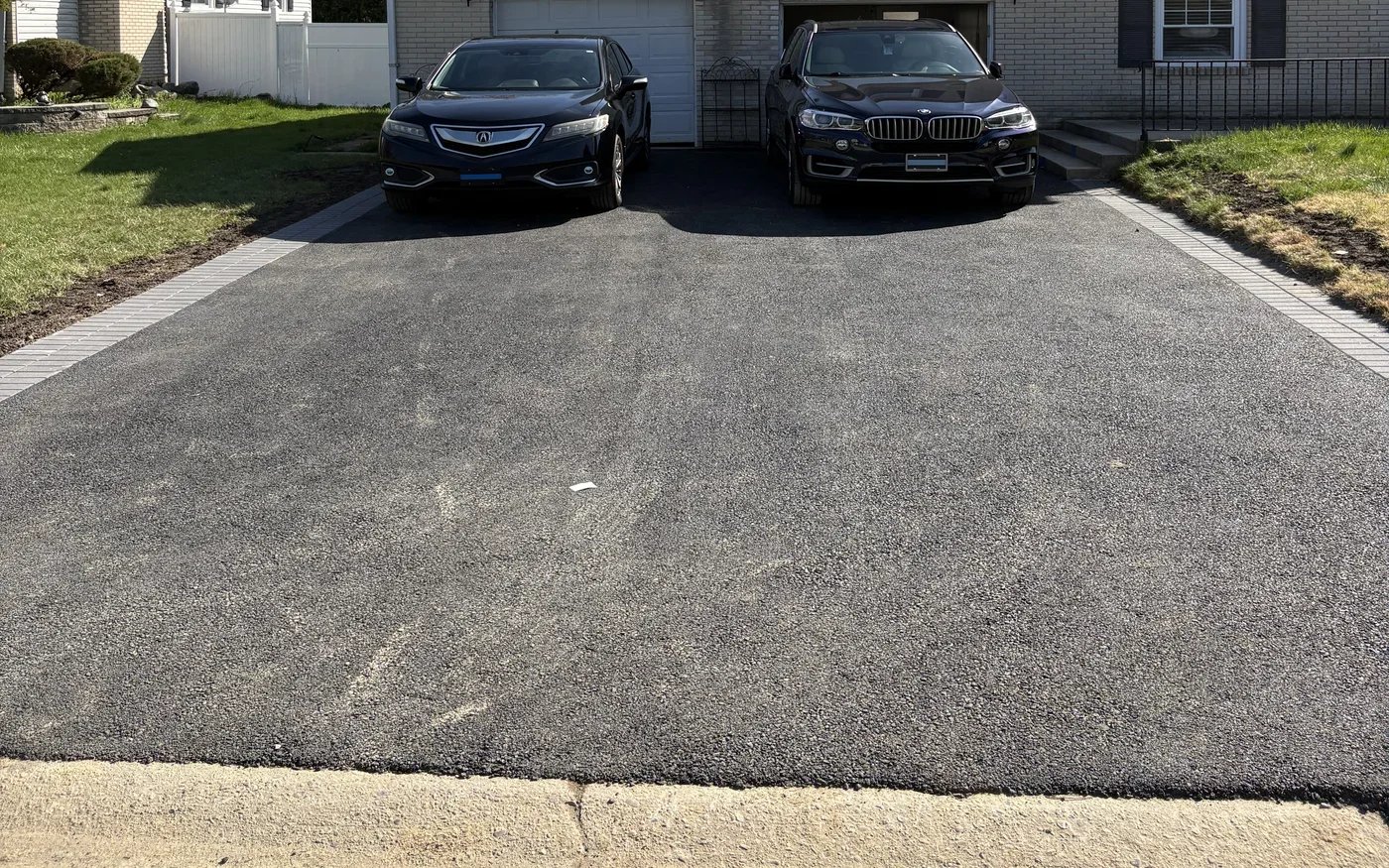 Freshly paved driveway after completion